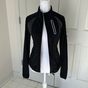 Athleta full zip jacket. Size extra small. Black and gray.
